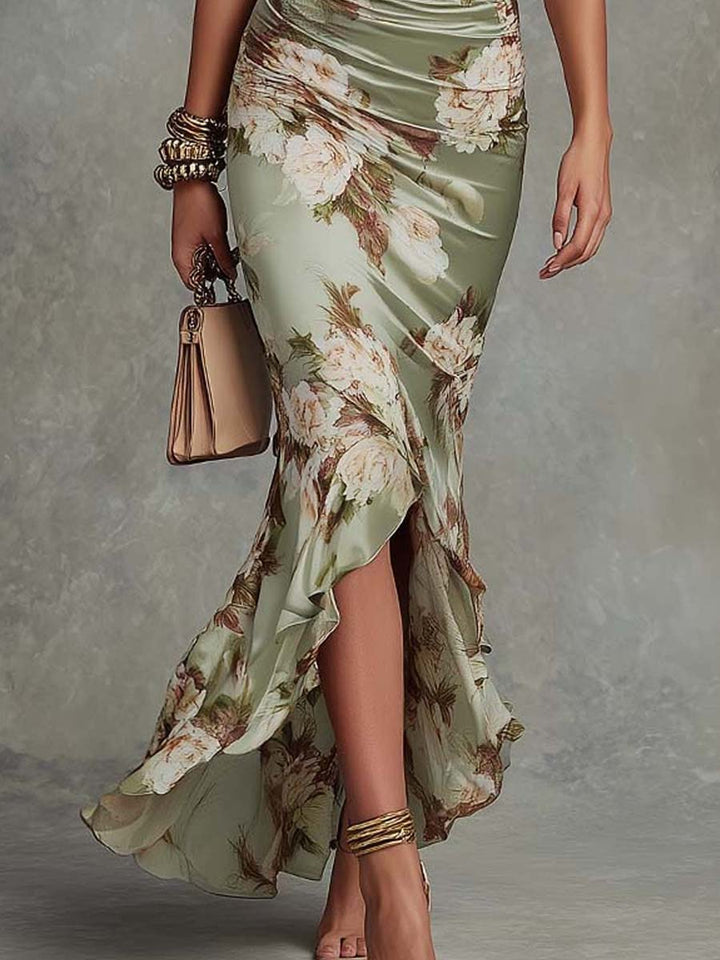 Anna - Abito lungo asimmetrico in satin verde con scollo a V, maniche a campana arricciate e motivo floreale